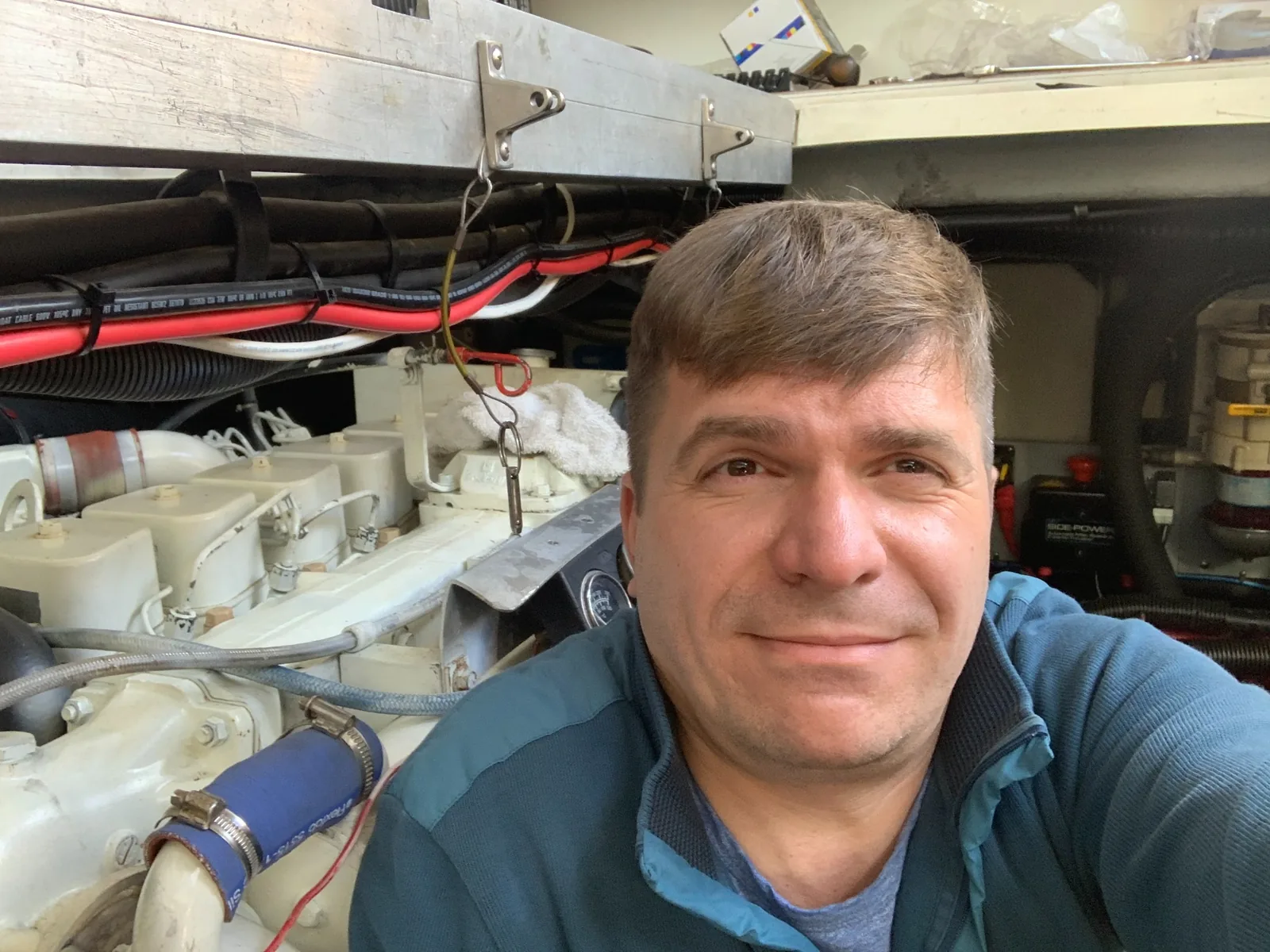 Mechanic inside a yacht engine room